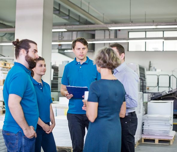 Group in blue shirts talking