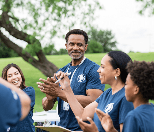 People wearing blue shirts at event